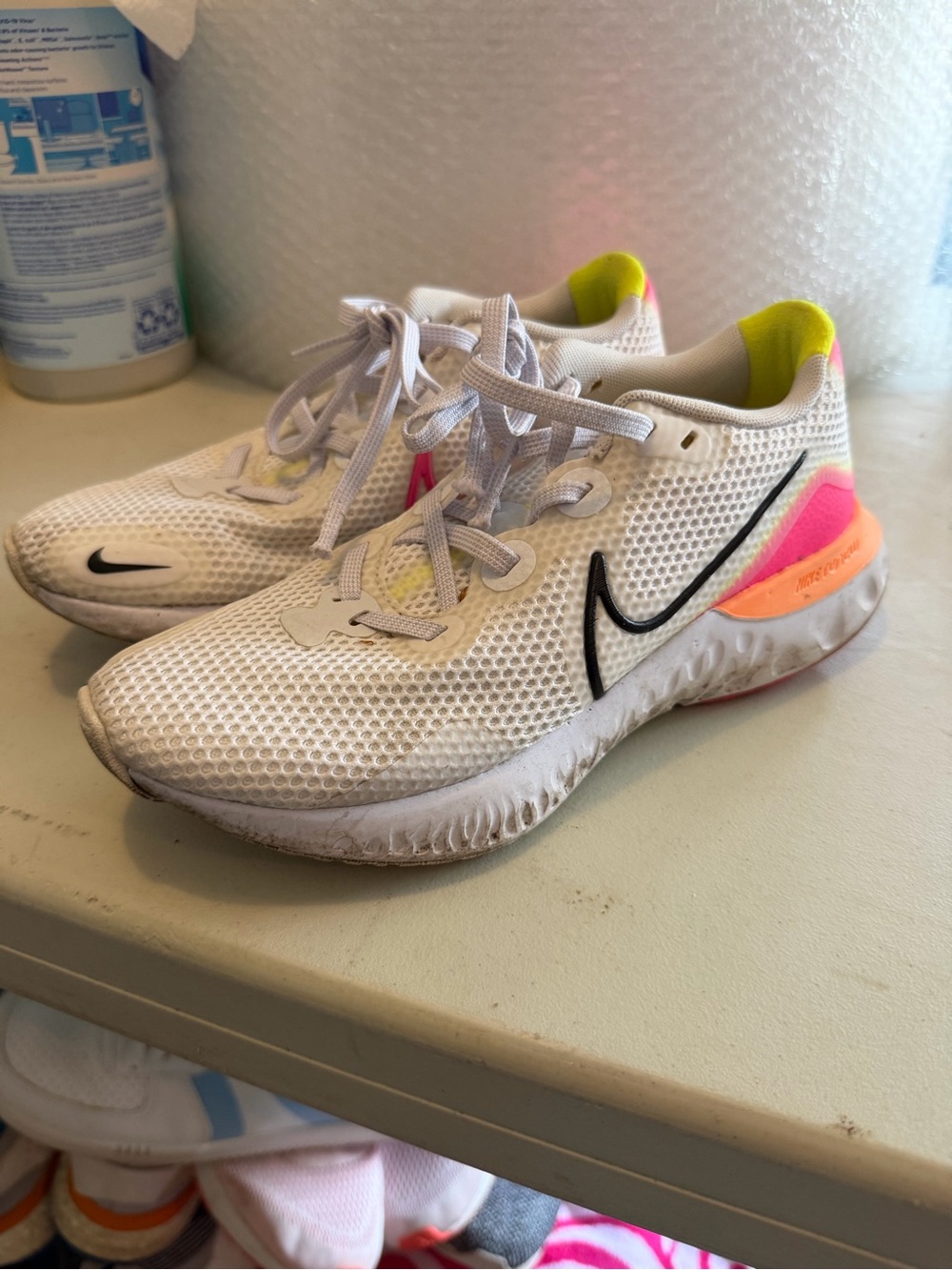 Nike womenβs size 7 Renew Running Shoe pink orange yellow